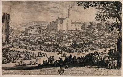 Crowds of people are in an open area at Impruneta, Tuscany, buying goods from stalls set under awnings