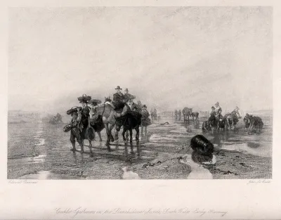 Crowds of people with donkeys are gathering cockles on the beach