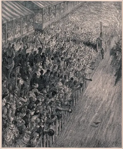 Crowds watching horses approach the finishing line of the Derby