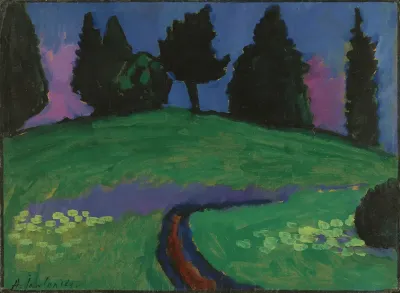 Dark trees over green slope