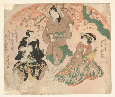 Drie acteurs onder bloesemboom.