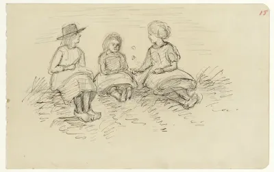 Drie zittende kinderen in het gras