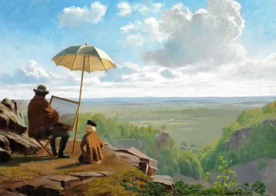 Early morning in Skäralid in Skåne, Sweden. The artist is working under a parasol