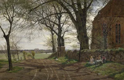 Early Spring: Dirt road at the village church Gressow, in the background Tressow castle near Wismar