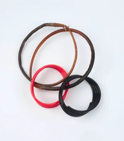 Earring, consisting of rings of cassowary feathers or celluloid