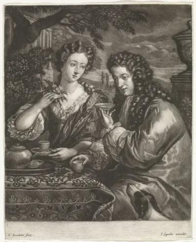 Een man en vrouw drinken koffie of thee in de tuin