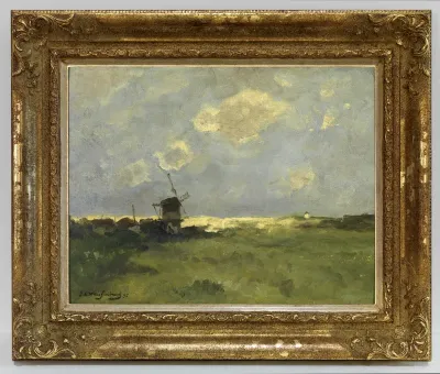 Een windmolen in de duinen.