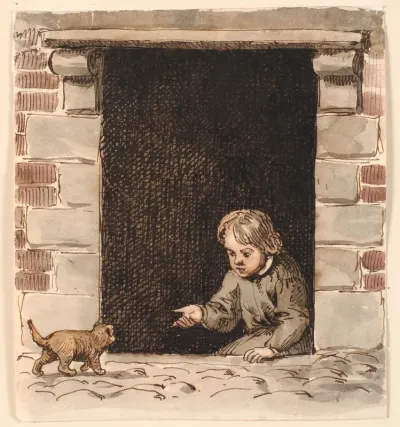En dreng, der sidder i en kælderdør, lokker for en hundehvalp.