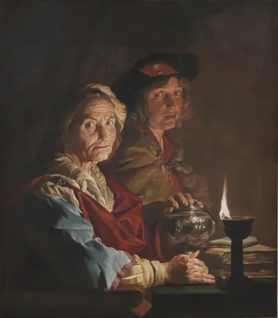 En gammel kone og en yngling i skæret fra en olielampe