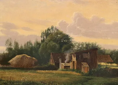 Evening landscape with sheds and trees.