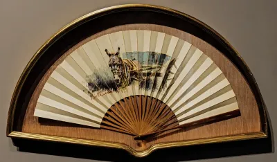 Fan with donkey pulling a cart