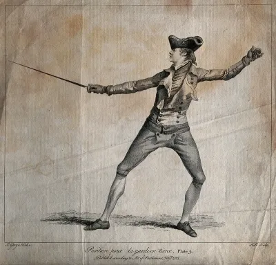 Fencing: a man is in position with a sword in his hand