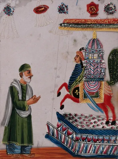 Festival of Muḥarram: a man praying to a replica of a martyr's tomb