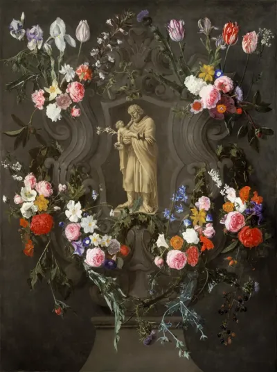 Floral decorations around a niche with St Joseph and the Christ Child