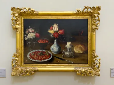 Flowers and fruit in vases with other objects