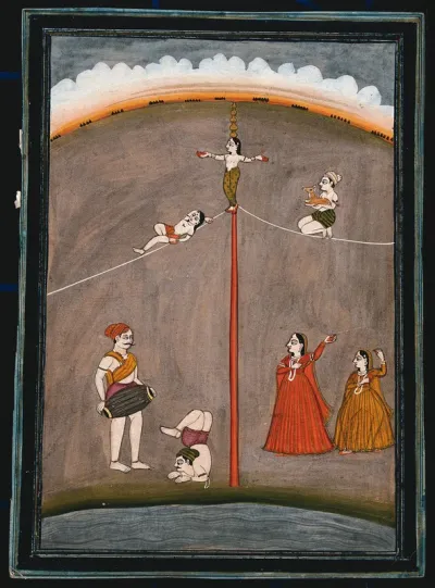 Four acrobats along with two dancing girls and a musician