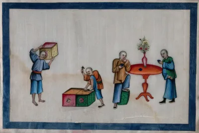 Four Chinese figures, two drinking tea, two packing boxes