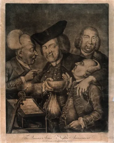 Four jovial gentlemen in a tavern, one holds a bowl to the face of his drunk companion