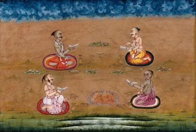 Four priests consult some writings and perform a yagna, a fire sacrifice, an old vedic ritual where offerings are made to the god of fire, Agni