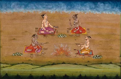 Four priests holding ritual vessels perform a yagna, a fire sacrifice, an old vedic ritual where offerings are made to the god of fire, Agni