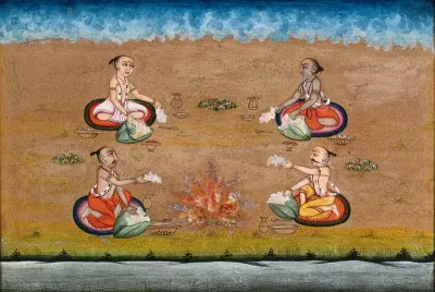 Four priests perform a yagna, a fire sacrifice, an old vedic ritual where offerings are made to the god of fire, Agni