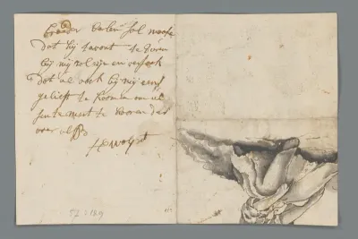 Fragment van een zittende figuur