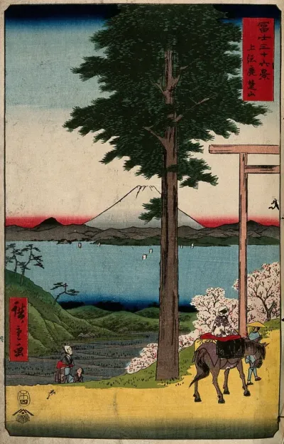 Fuji seen from Kazusa province across the bay from Edo; a woman is led on horseback through a shinto gate