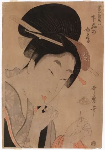 Geisha pujottamassa lankaa silmäneulaan