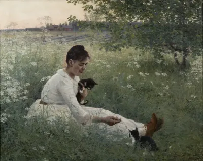 Girl with cats in a summer landscape