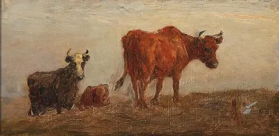 Grazing cows on a hill.