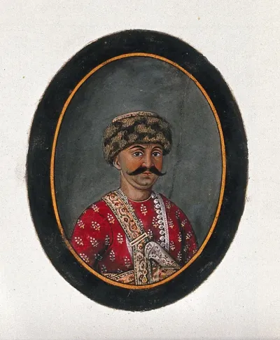Hassan Raza Khan wearing a woollen cap and a red attire