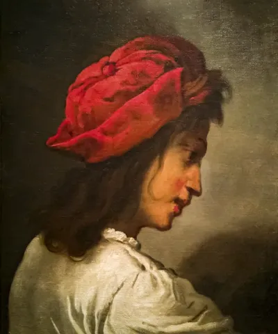 Head of a young man with a cap