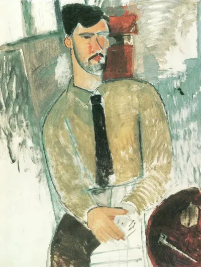 Henri Laurens seated at a table