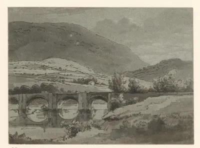 Heuvelachtig landschap met brug over een rivier