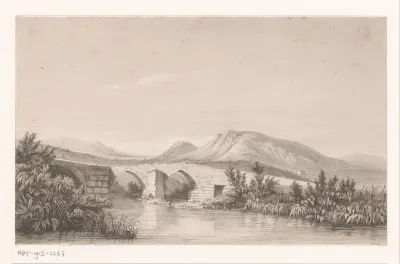 Heuvellandschap met brug over het water
