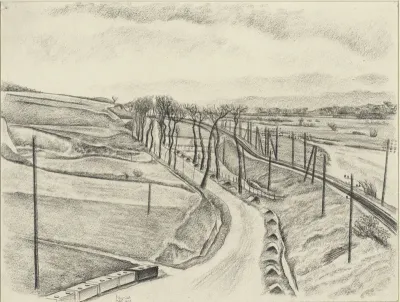 Heuvellandschap met weg en spoorlijn