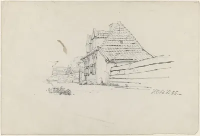 Huis aan een weg met schutting