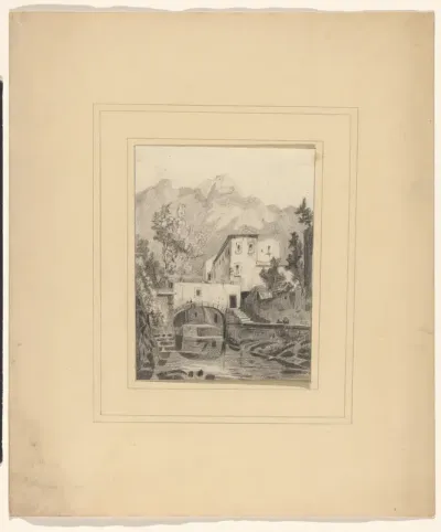 Huis bij een kanaal aan de voet van een berg