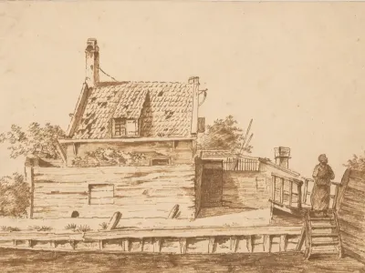 Huis met houten omheining aan het water