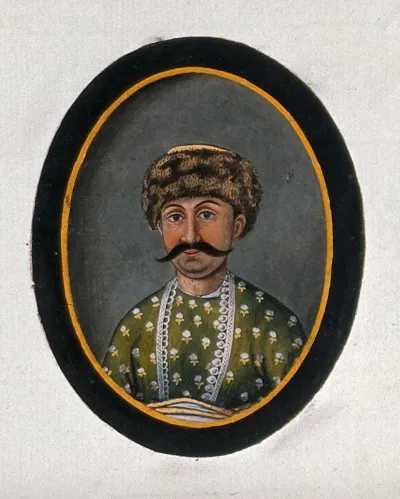 Hyder Beg Khan wearing a fur cap and a green attire