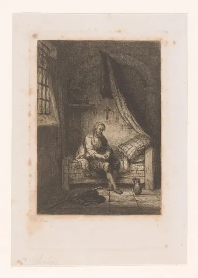 Interieur met man op de rand van zijn bed