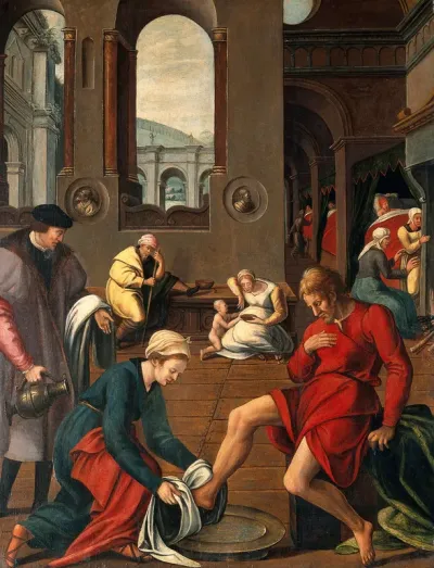 Interior of a hospital with a woman washing a man's feet