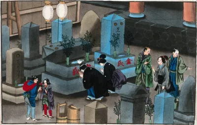 Japanese funeral customs: relatives pay their respects at the ancestral grave
