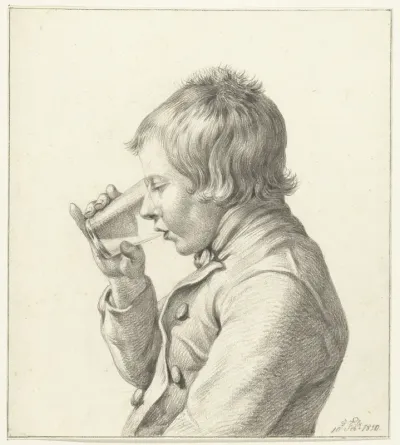 Jongen, drinkend uit een glas