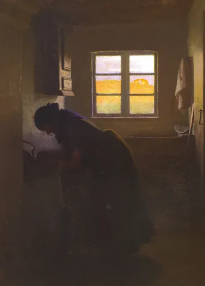 Kitchen interior with woman working.
