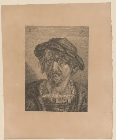 Kop van een man met muts