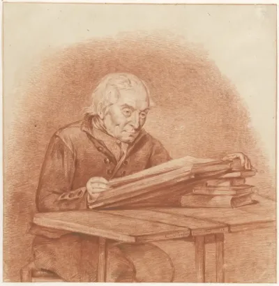 Lezende man, zittend aan tafel