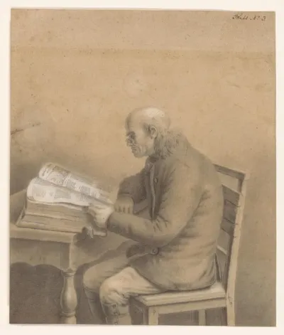 Lezende oude man aan een tafel