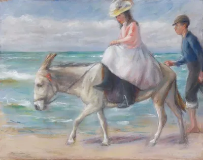 Mädchen beim Eselreiten am Strand von Scheveningen