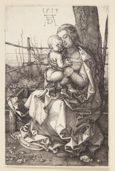 Madonna, siddende ved et træ